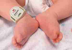 closeup of hugs tag on infant