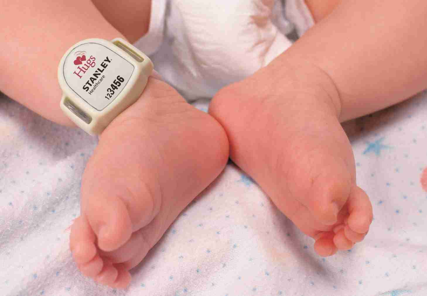 closeup of hugs tag on infant