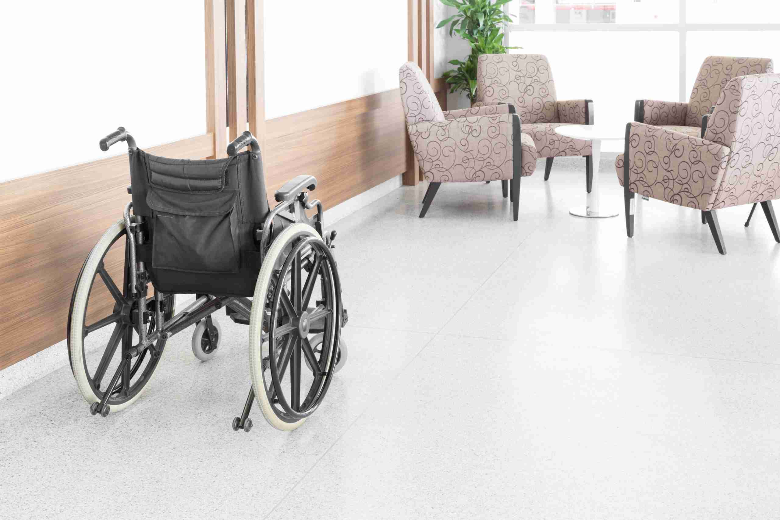 empty wheelchair in nursing home sitting room