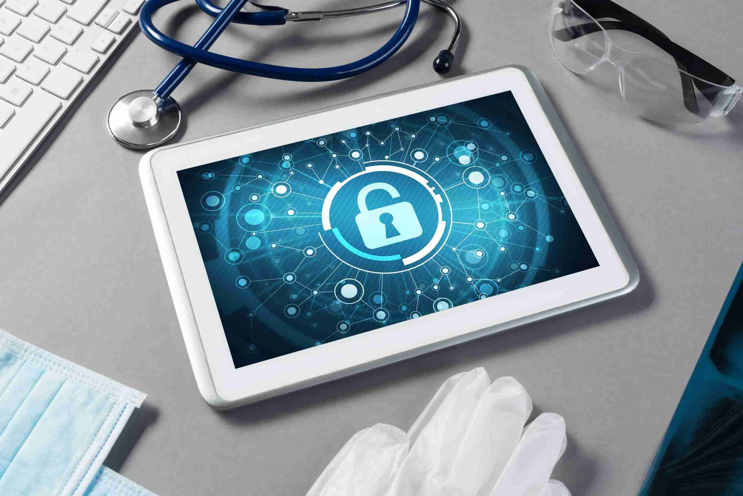 tablet on a desk with medical equipment and supplies