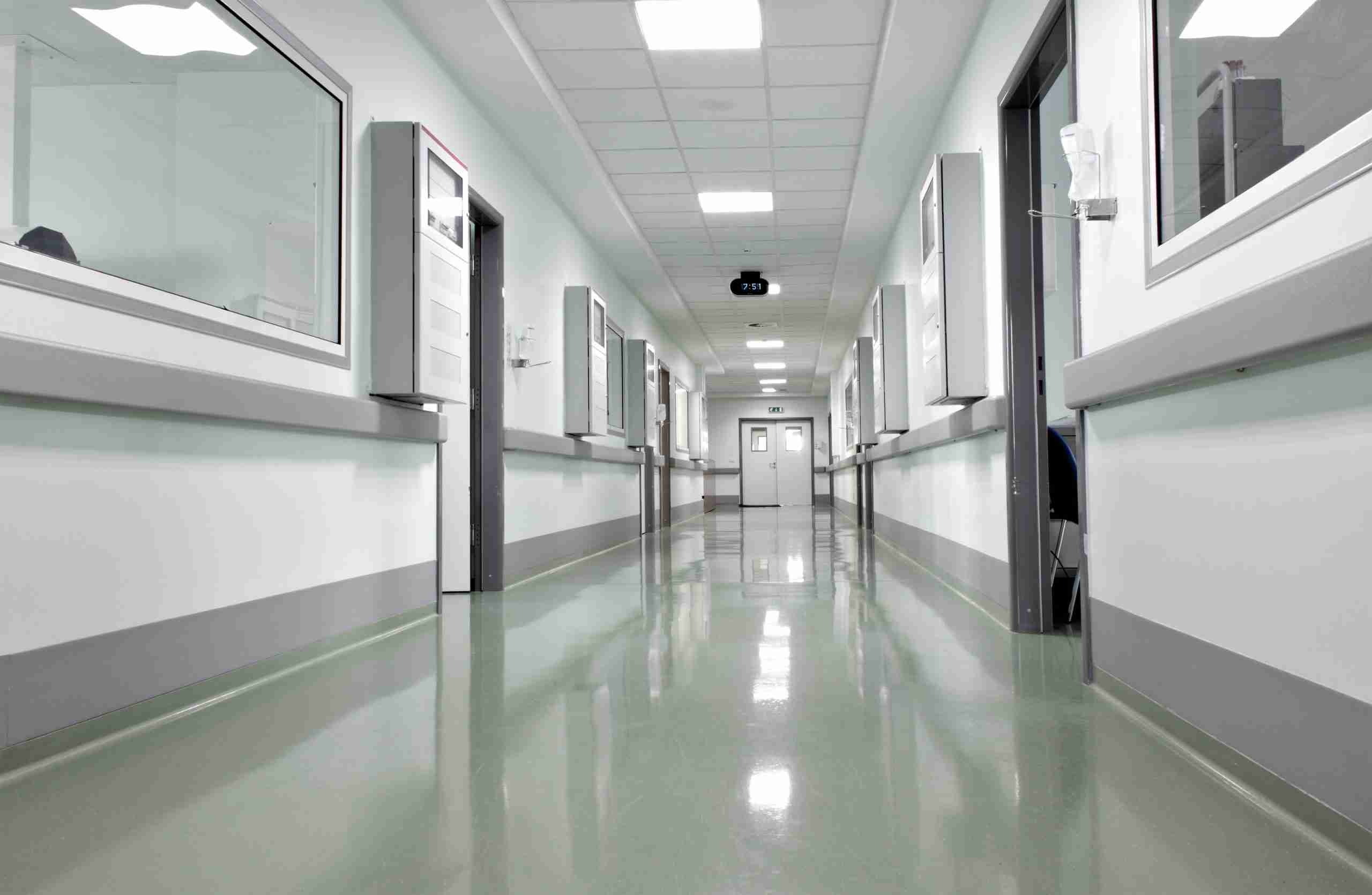 empty hospital corridor with secure doors