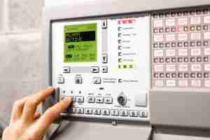 fire alarm control panel open and activated in alert mode