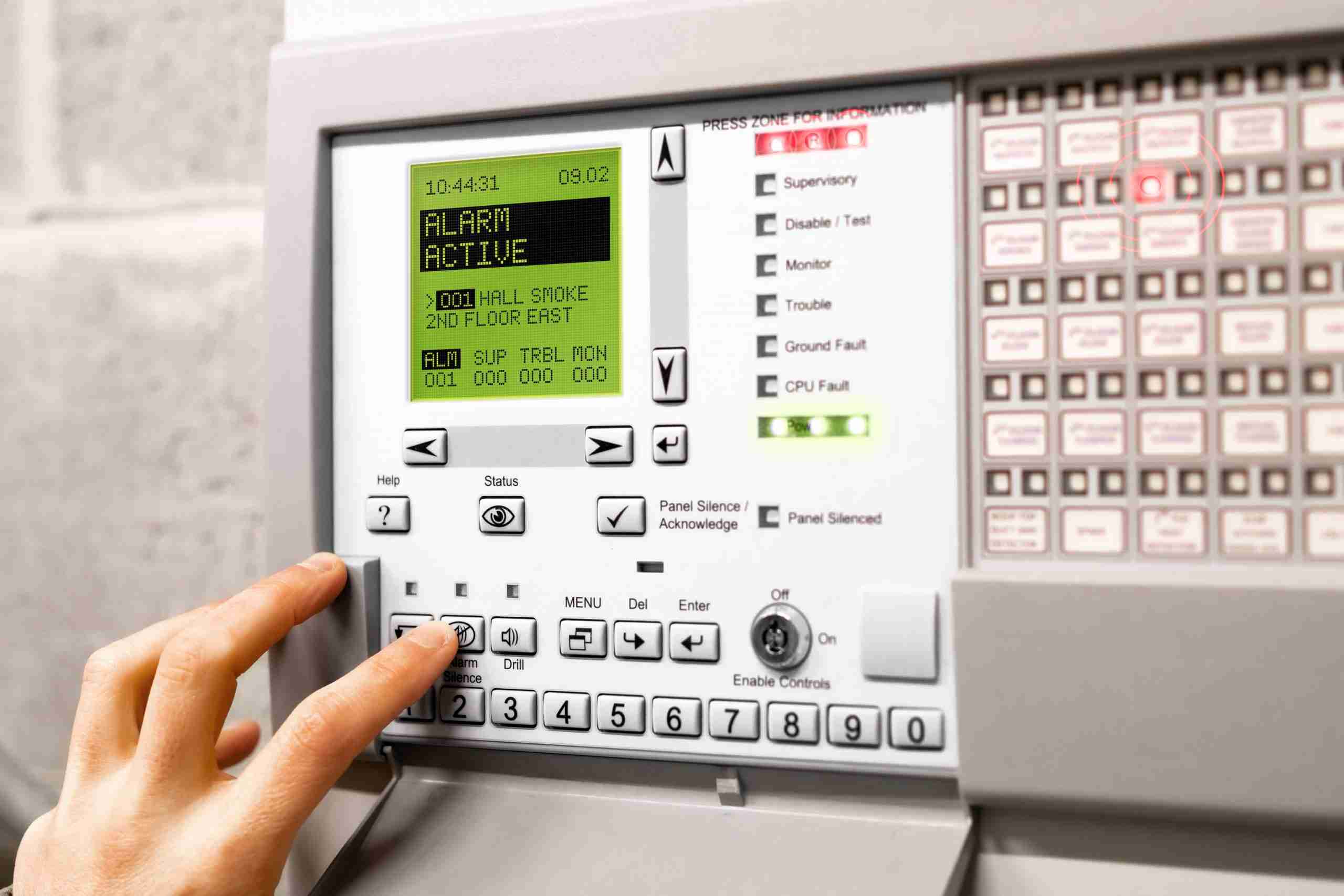 fire alarm control panel open and activated in alert mode