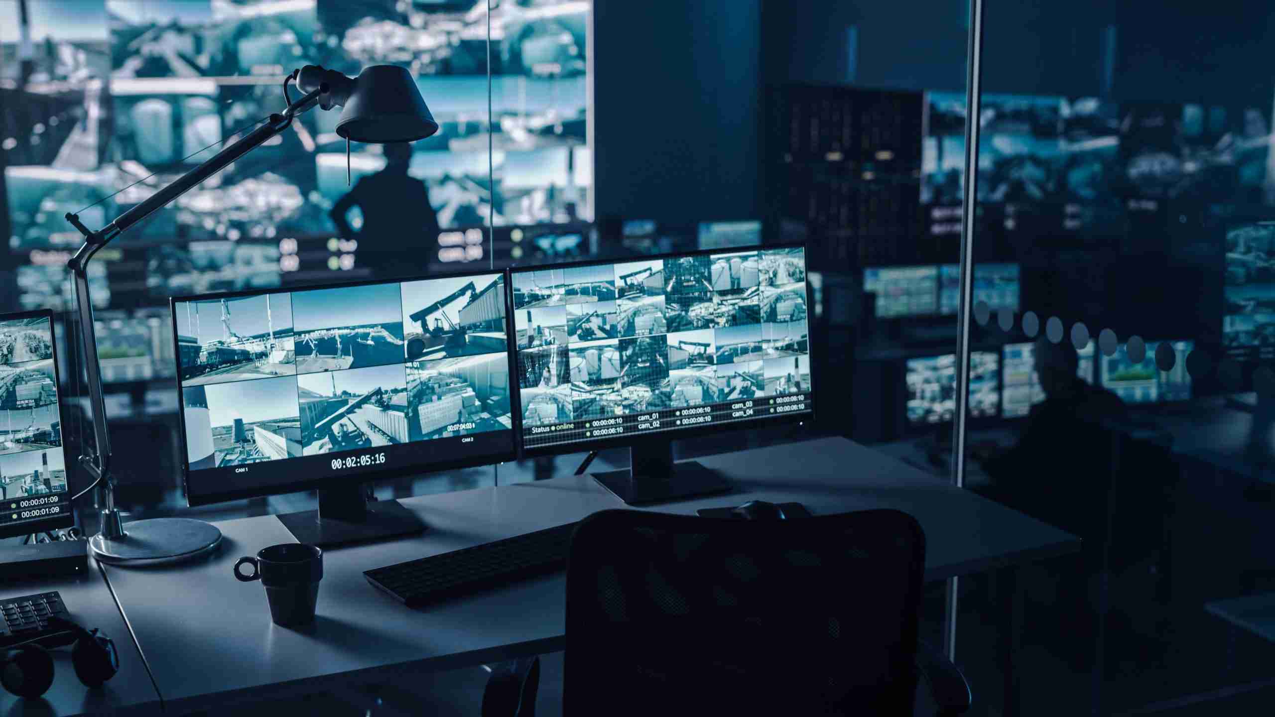 comprehensive video surveillance concept - computer screens showing cctvs views from multiple security cameras