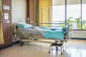 hospital patient room with bed and nurse call system