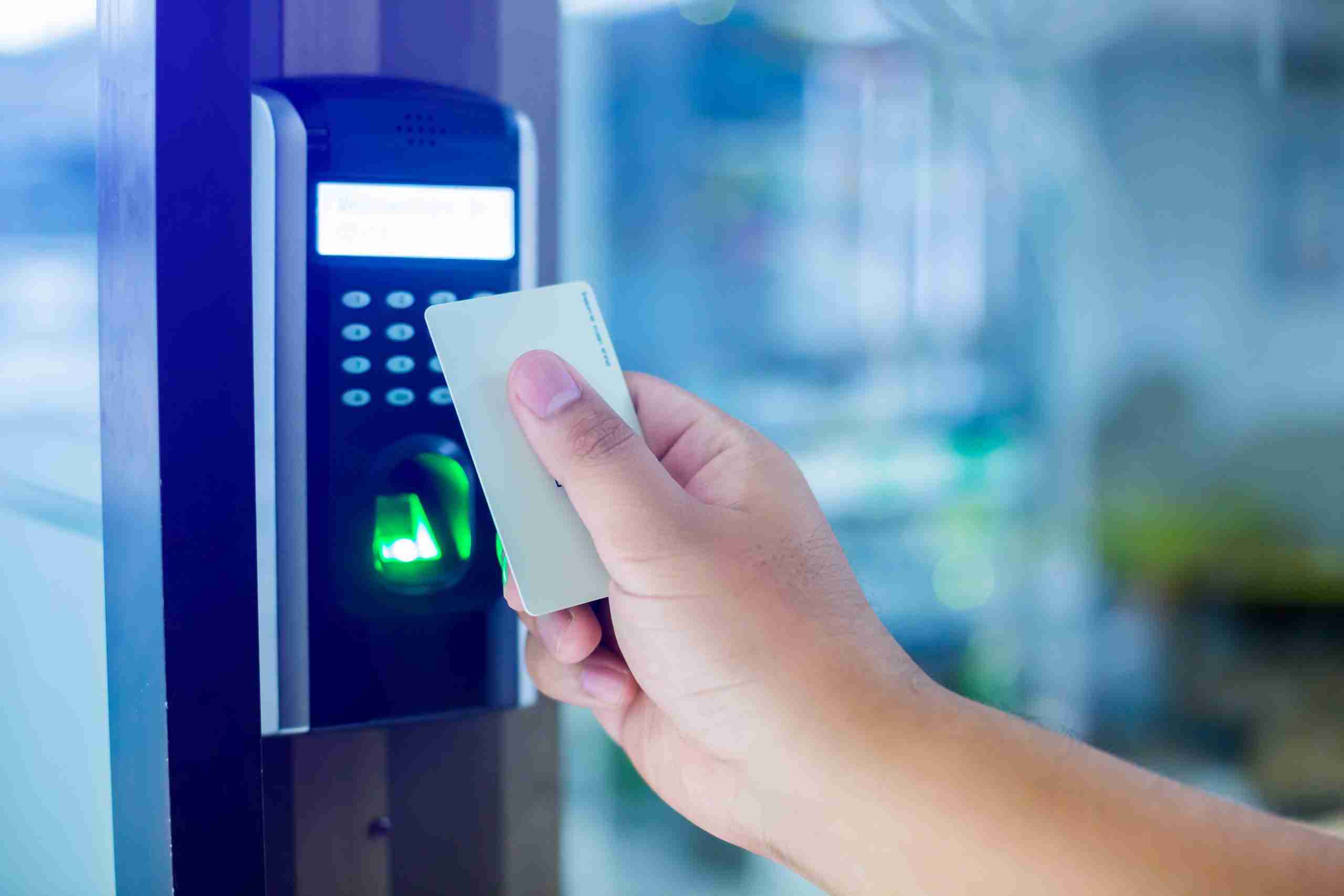 person using keycard on multi-modal access control reader